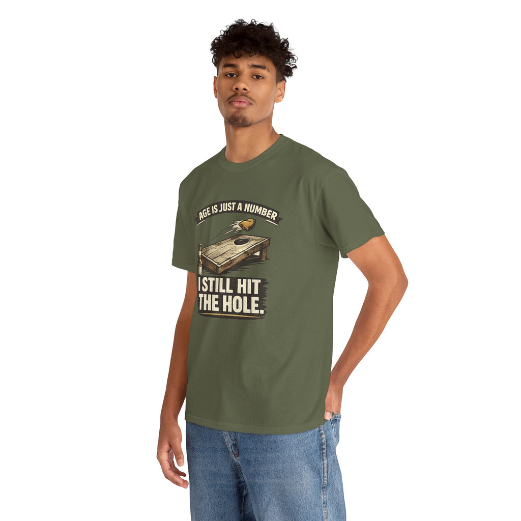 Cornhole Graphic Tee — "Age Is Just a Number, I Still Hit the Hole" Funny Corn Toss Shirt