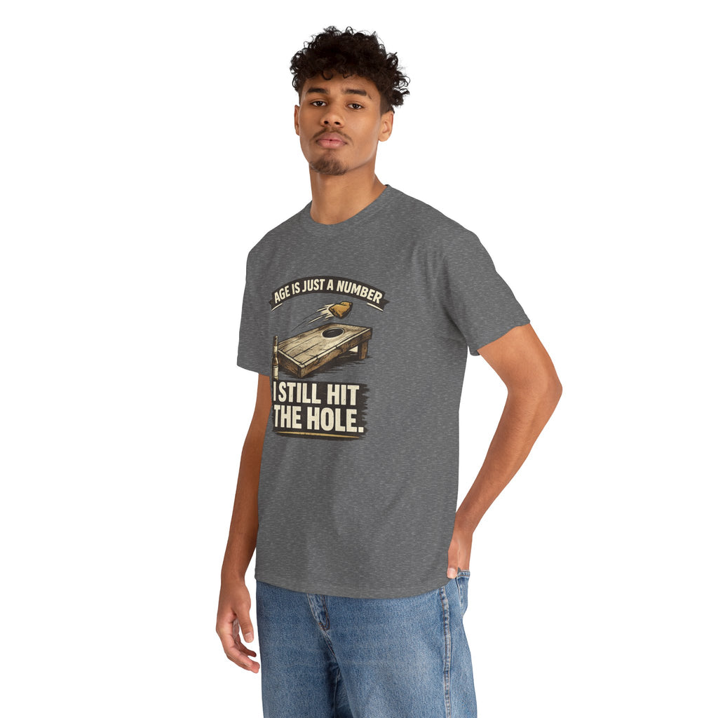 Cornhole Graphic Tee — "Age Is Just a Number, I Still Hit the Hole" Funny Corn Toss Shirt