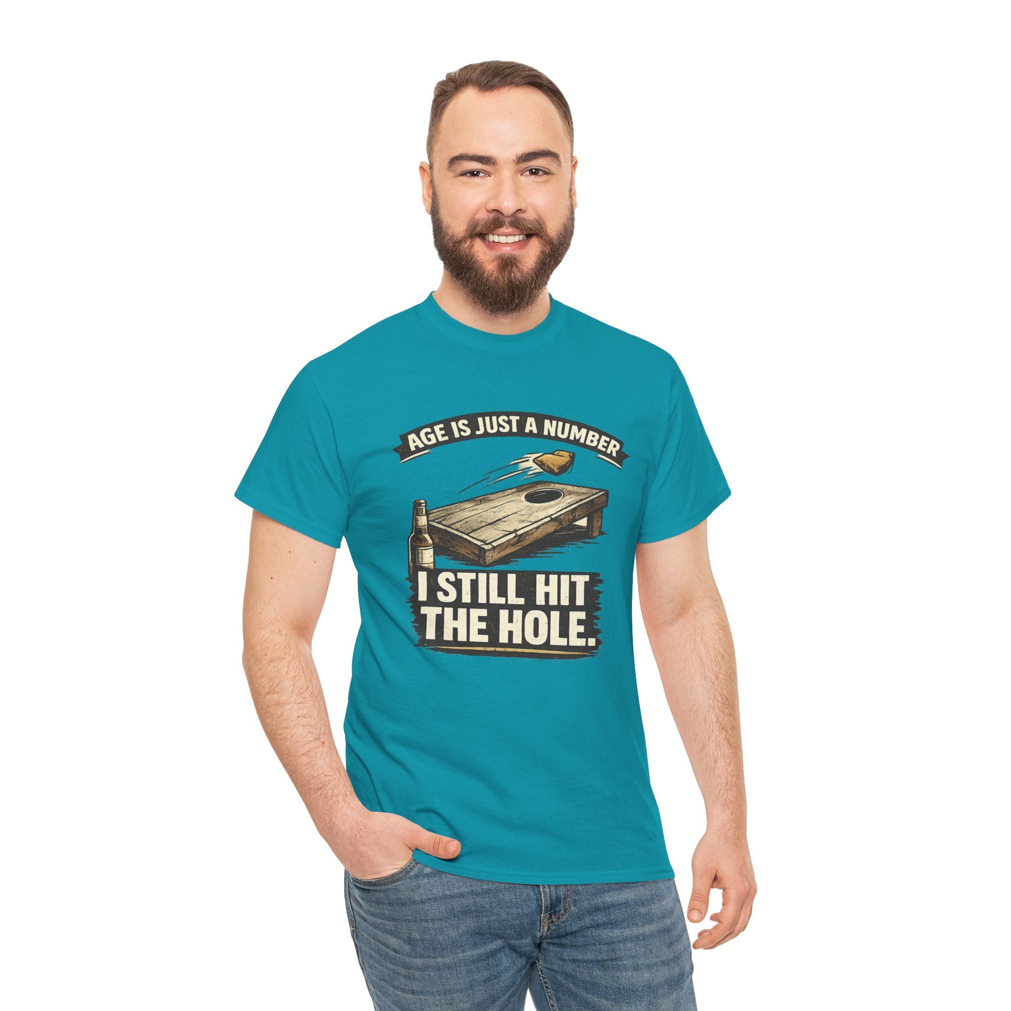 Cornhole Graphic Tee — "Age Is Just a Number, I Still Hit the Hole" Funny Corn Toss Shirt