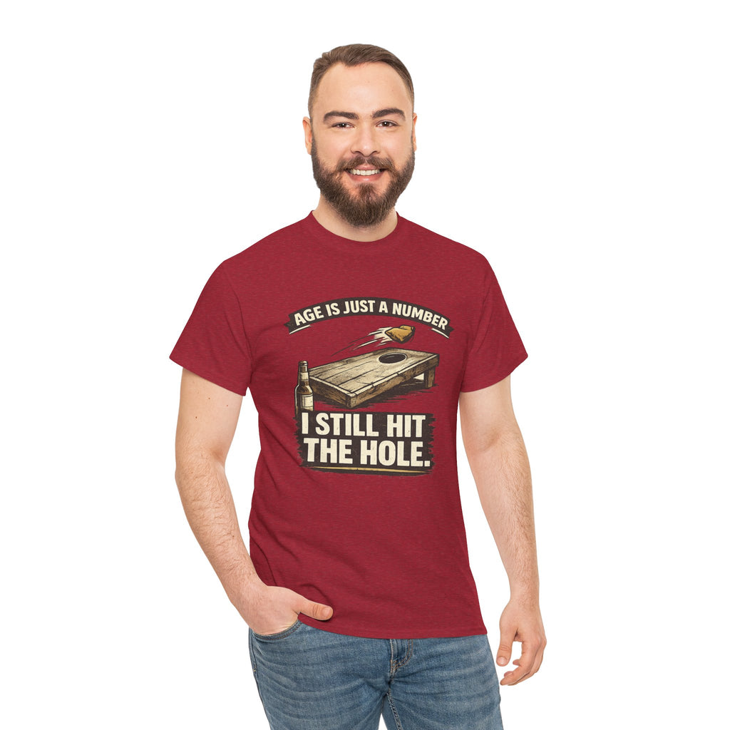 Cornhole Graphic Tee — "Age Is Just a Number, I Still Hit the Hole" Funny Corn Toss Shirt