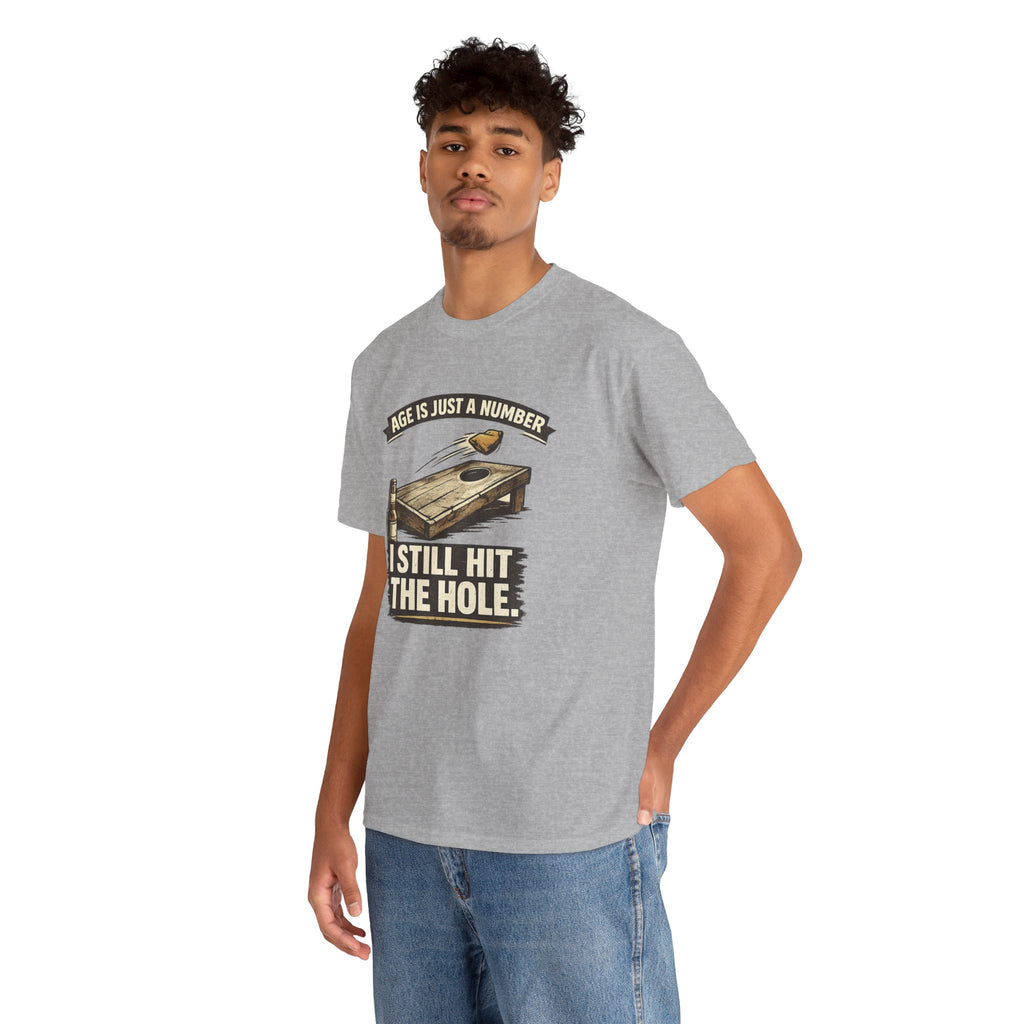 Cornhole Graphic Tee — "Age Is Just a Number, I Still Hit the Hole" Funny Corn Toss Shirt