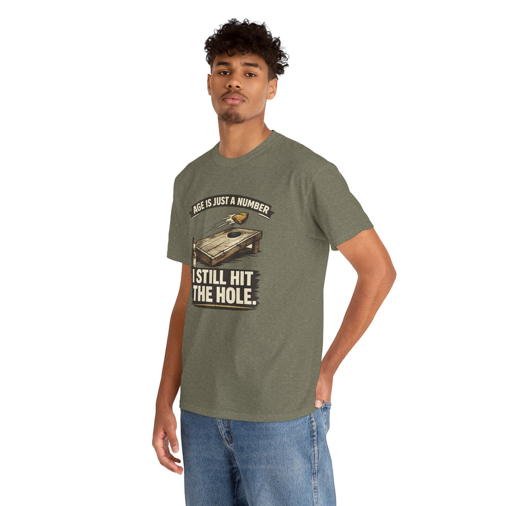 Cornhole Graphic Tee — "Age Is Just a Number, I Still Hit the Hole" Funny Corn Toss Shirt