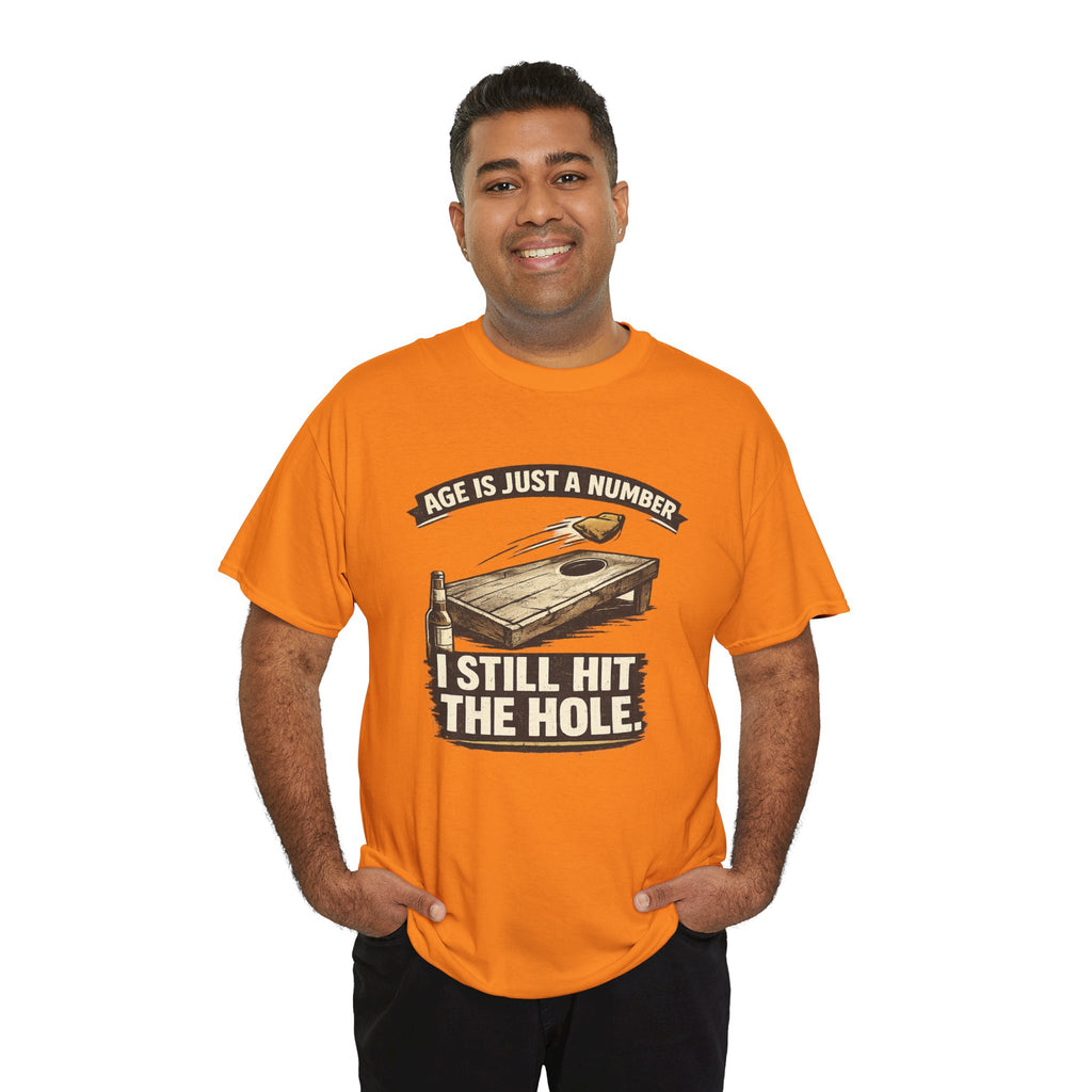 Cornhole Graphic Tee — "Age Is Just a Number, I Still Hit the Hole" Funny Corn Toss Shirt