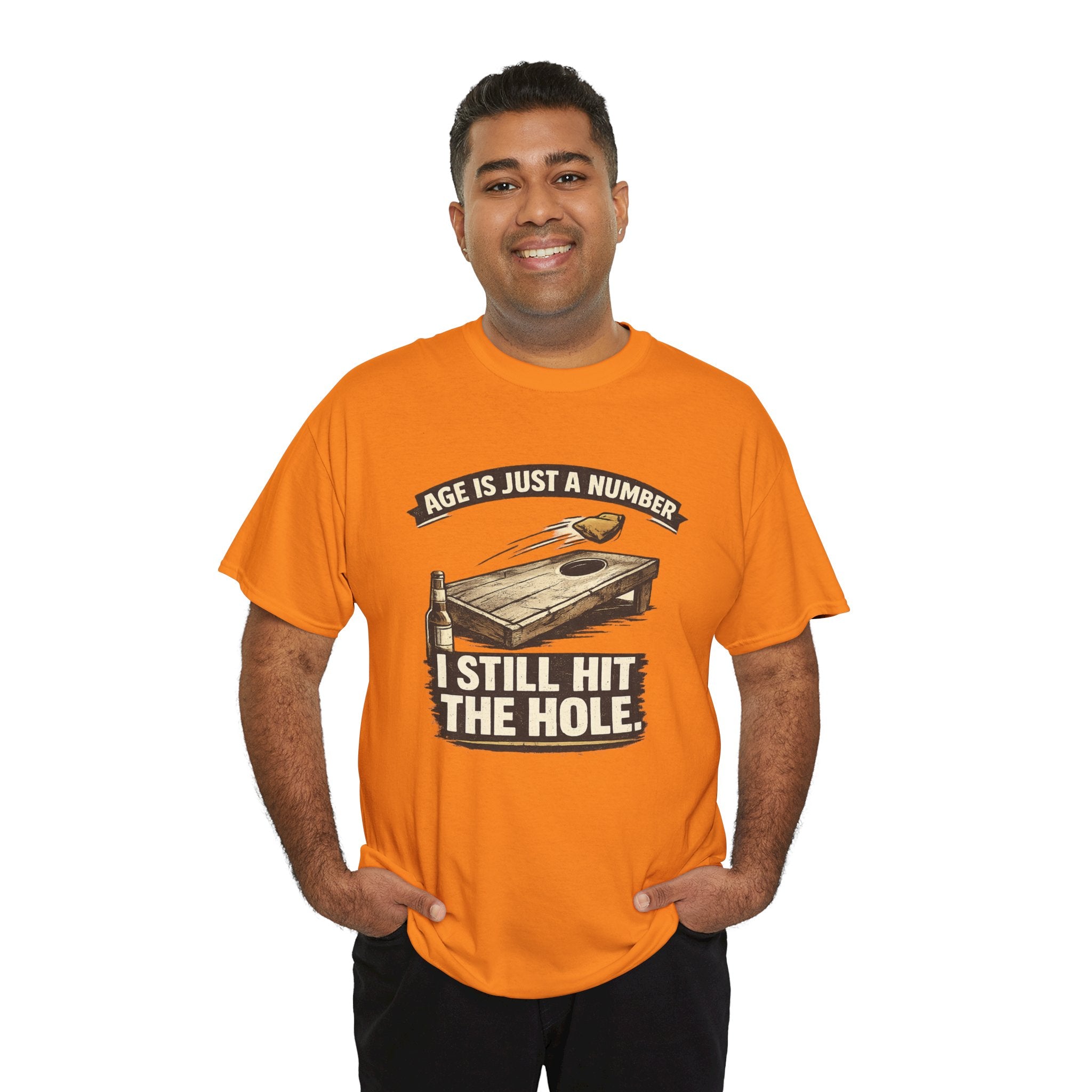 Cornhole Graphic Tee — "Age Is Just a Number, I Still Hit the Hole" Funny Corn Toss Shirt