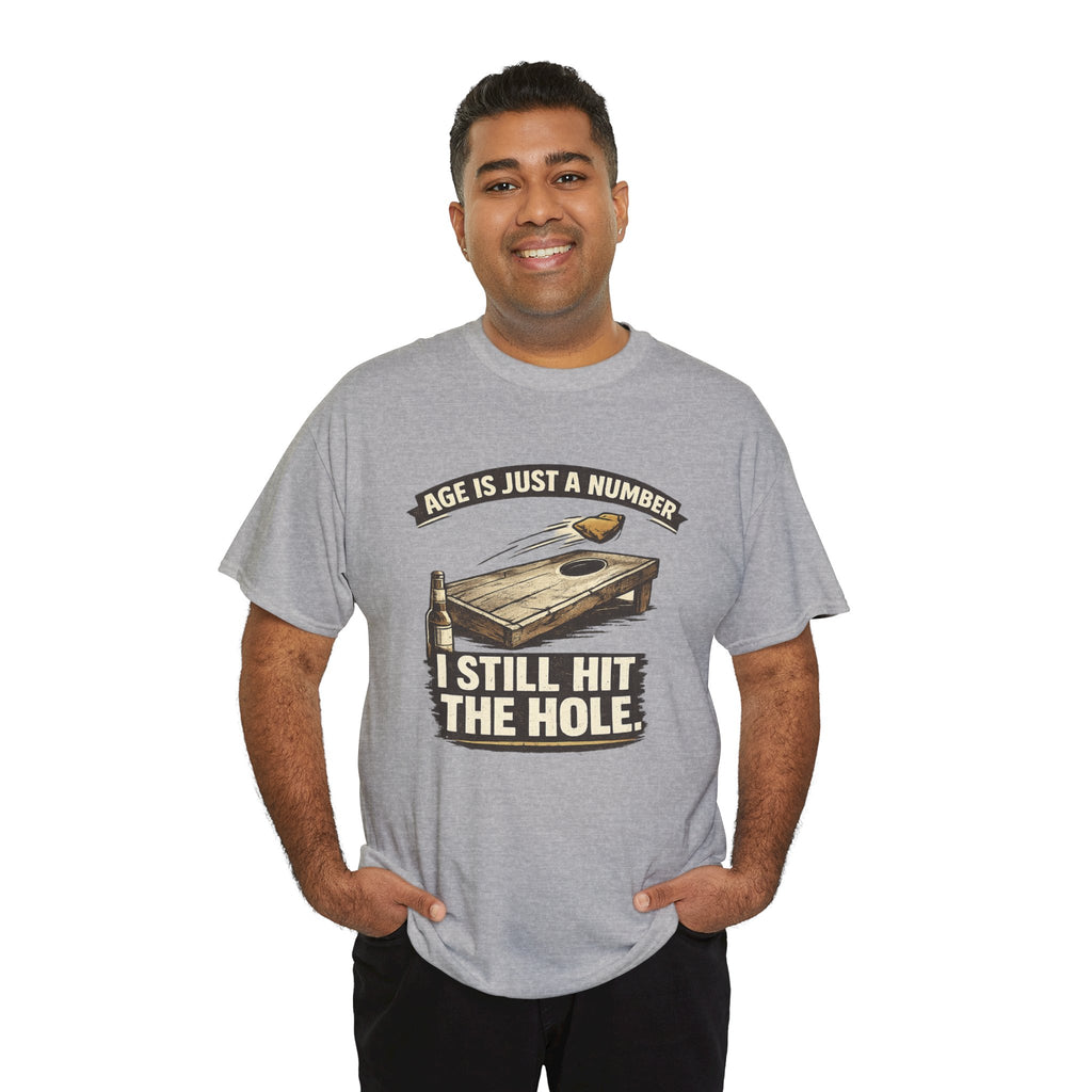 Cornhole Graphic Tee — "Age Is Just a Number, I Still Hit the Hole" Funny Corn Toss Shirt